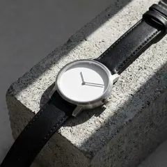 Gemini 3 Pro Image — A minimalist wristwatch with a black leather strap