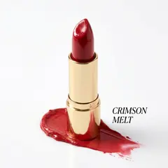 Gemini 3 Pro Image — A tube of red lipstick standing upright, melting s