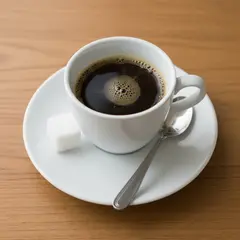 Gemini 2.5 Flash Image — A cup of coffee on a saucer, with a spoon to the r