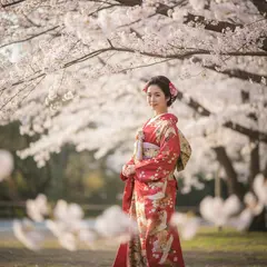 Gemini 2.5 Flash Image — A Japanese woman in a red kimono standing under ch