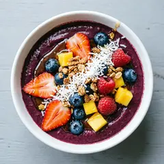 Qwen Image 2.0 — A colorful acai bowl topped with fresh berries, gr