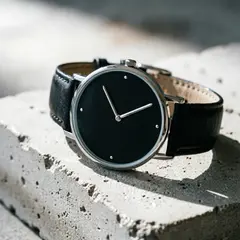 Qwen Image 2.0 — A minimalist wristwatch with a black leather strap