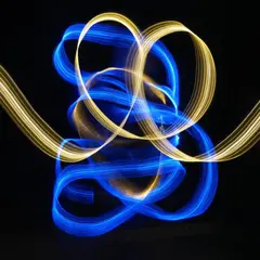 Qwen Image — Intertwining ribbons of light in blue and gold aga