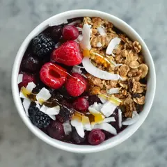 Qwen Image — A colorful acai bowl topped with fresh berries, gr