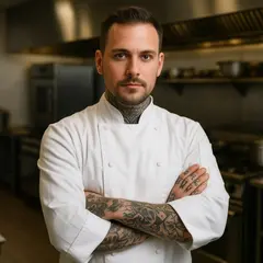 Qwen Image — A tattooed chef in a white coat, arms crossed, con