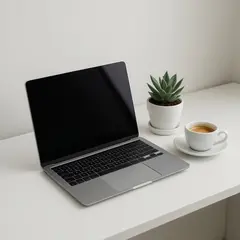 Qwen Image — A sleek laptop on a clean white desk with a potted