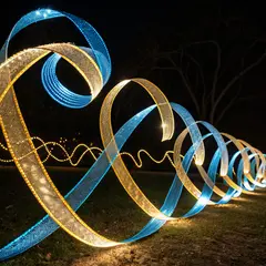 Recraft V3 — Intertwining ribbons of light in blue and gold aga