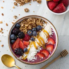 Recraft V3 — A colorful acai bowl topped with fresh berries, gr