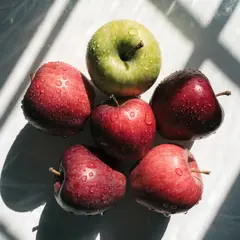 Recraft V4 — Five red apples arranged in a circle on a white ta