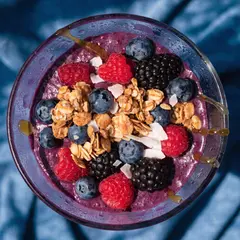 Recraft V4 — A colorful acai bowl topped with fresh berries, gr