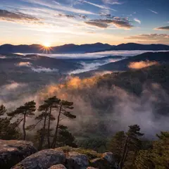 Recraft V4 — A misty mountain range at sunrise, layers of purpl