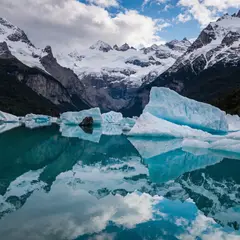 Recraft V4 — A turquoise glacial lake surrounded by snow-capped