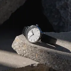 Recraft V4 — A minimalist wristwatch with a black leather strap