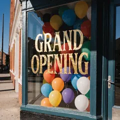 Recraft V4 — A storefront window with GRAND OPENING painted in 