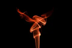 Reve v1.0 — Smoke tendrils forming the shape of a phoenix, bac