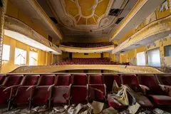 Reve v1.0 — An abandoned Art Deco theater with peeling gold pa