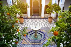 Reve v1.0 — A traditional riad courtyard with intricate zellig