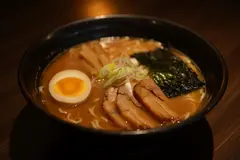 Reve v1.0 — A steaming bowl of ramen with chashu pork, soft-bo