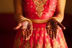 Reve v1.0 — An Indian bride in traditional red and gold leheng