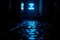 Reve v1.0 — A glowing neon sign reading OPEN 24 HOURS in a dar