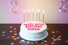 Reve v1.0 — A birthday cake with HAPPY 30TH BIRTHDAY SARAH wri