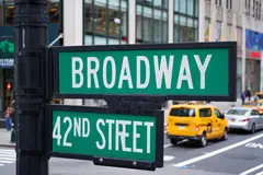 Reve v1.0 — A street sign at the intersection of BROADWAY and 
