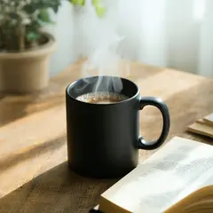 SD 3.5 Large — A matte black coffee mug with steam rising, placed