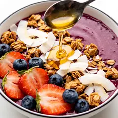 Seedream v4.5 — A colorful acai bowl topped with fresh berries, gr