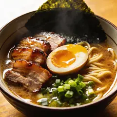 Seedream v4.5 — A steaming bowl of ramen with chashu pork, soft-bo