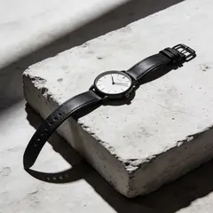 Seedream v4.5 — A minimalist wristwatch with a black leather strap