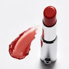 Seedream v4.5 — A tube of red lipstick standing upright, melting s