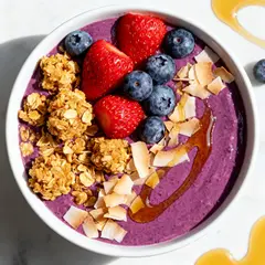 Seedream v4 — A colorful acai bowl topped with fresh berries, gr