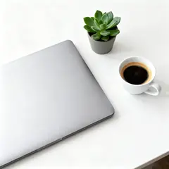 Seedream v4 — A sleek laptop on a clean white desk with a potted