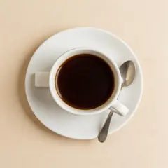 Seedream v5 Lite — A cup of coffee on a saucer, with a spoon to the r