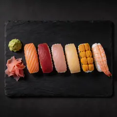 Seedream v5 Lite — A perfectly plated sushi omakase on a black slate 