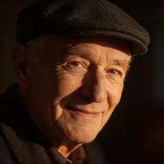 Seedream v5 Lite — An elderly man with a weathered face and kind smil