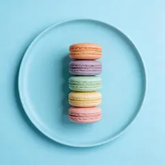 Seedream v5 Lite — A stack of colorful macarons on a pastel blue plat