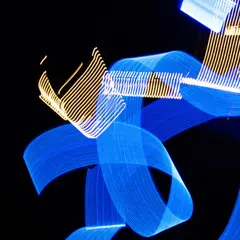 Wan 2.6 T2I — Intertwining ribbons of light in blue and gold aga