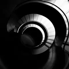 Wan 2.6 T2I — A spiral staircase viewed from directly above, geo