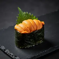 Wan 2.6 T2I — A perfectly plated sushi omakase on a black slate 