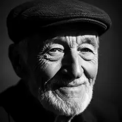 Wan 2.6 T2I — An elderly man with a weathered face and kind smil