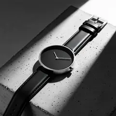 Wan 2.6 T2I — A minimalist wristwatch with a black leather strap