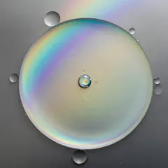 Z-Image Turbo — A macro photograph of oil droplets on water, iride