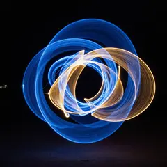 Z-Image Turbo — Intertwining ribbons of light in blue and gold aga