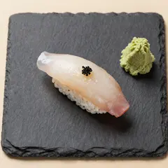Z-Image Turbo — A perfectly plated sushi omakase on a black slate 