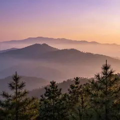 Z-Image Turbo — A misty mountain range at sunrise, layers of purpl