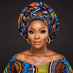 Z-Image Turbo — A woman with elaborate gele headwrap and bold eye 