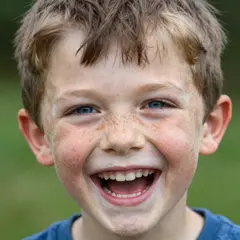 Z-Image Turbo — A freckled boy with bright blue eyes and messy hai