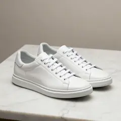 Z-Image Turbo — A pair of white leather sneakers on a marble count