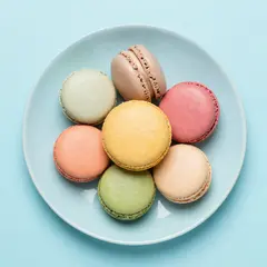 Z-Image Turbo — A stack of colorful macarons on a pastel blue plat
